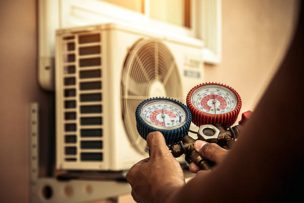 Professional Air Conditioning Service technician working in Boston, KY